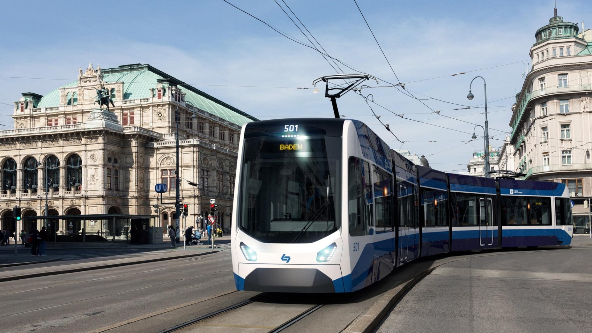 Eine blaue und weiße Straßenbahn "Baden 501" in Wien mit der Wiener Staatsoper im Hintergrund.