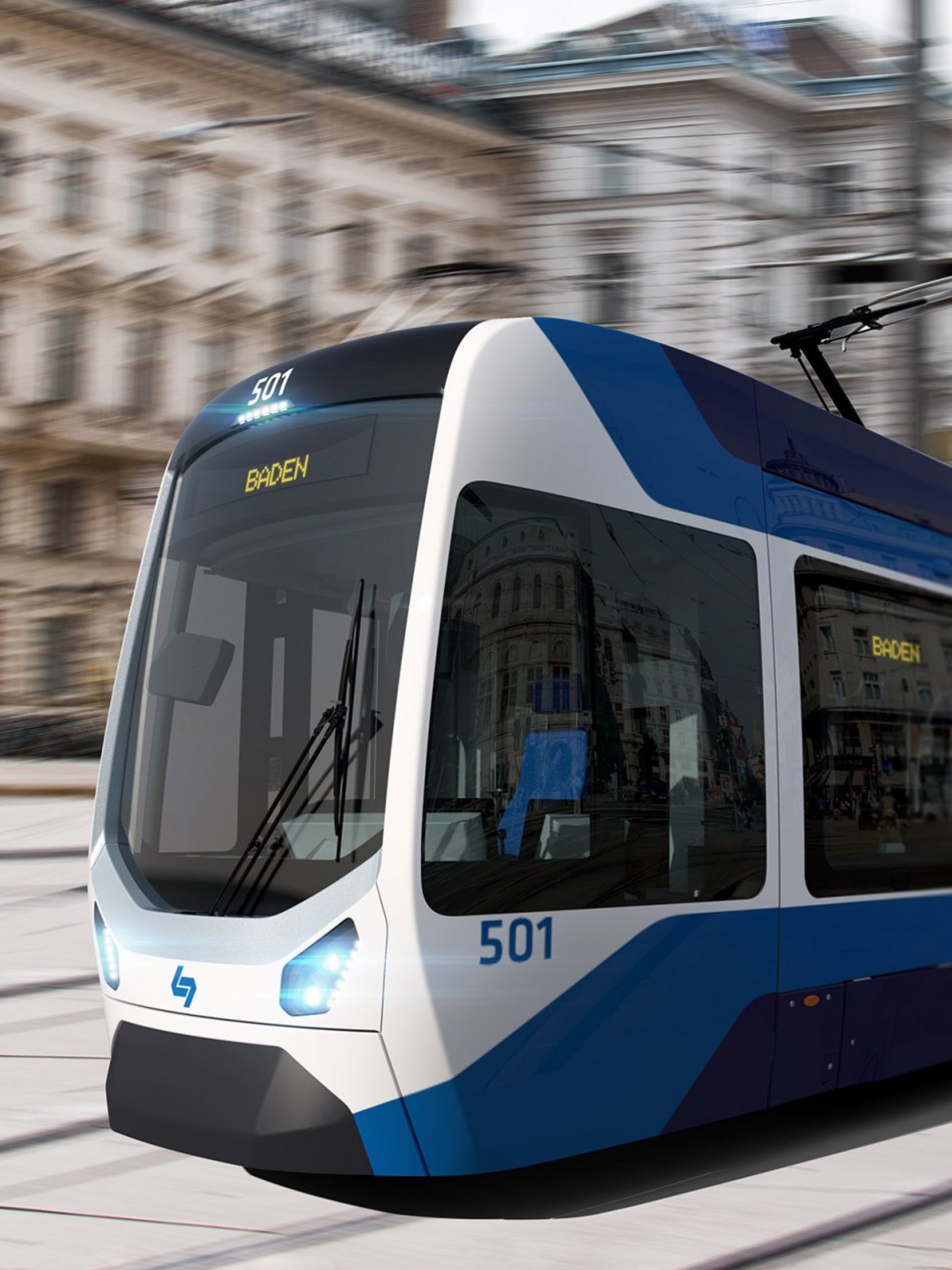 Eine blaue und weiße Straßenbahn mit der Aufschrift "501 BADEN" fährt durch die Stadt.