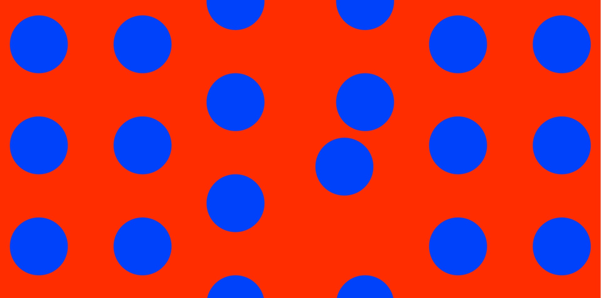 Ein oranger Hintergrund mit einem Muster aus blauen Punkten.