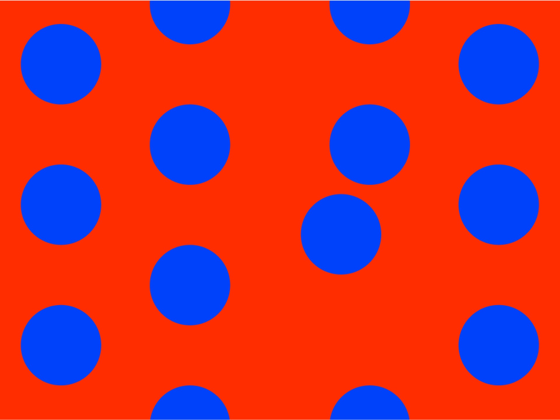 Ein oranger Hintergrund mit einem Muster aus blauen Punkten.